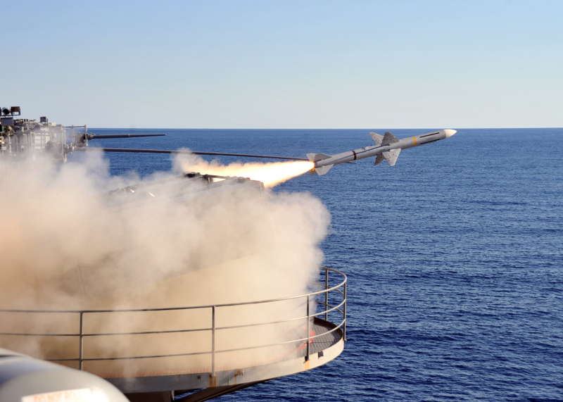 USS Enterpise the first nuclear powered carrier fires and AIM-7 SeaSparrow.